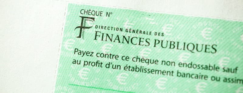 PARIS, FRANCE - JAN 1, 2015: Detail of French Cheque issued by the Direction Generale des Finances Publiques - the division of Economic Minister responsible for income taxes